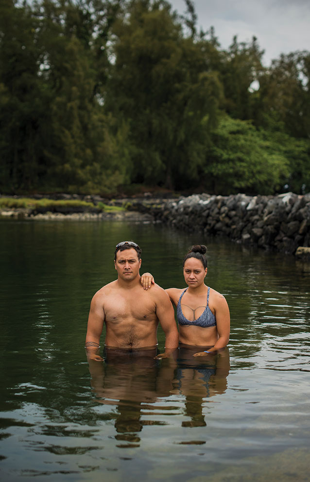 two people standing in water
