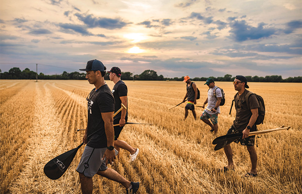 a group of people walking in a field