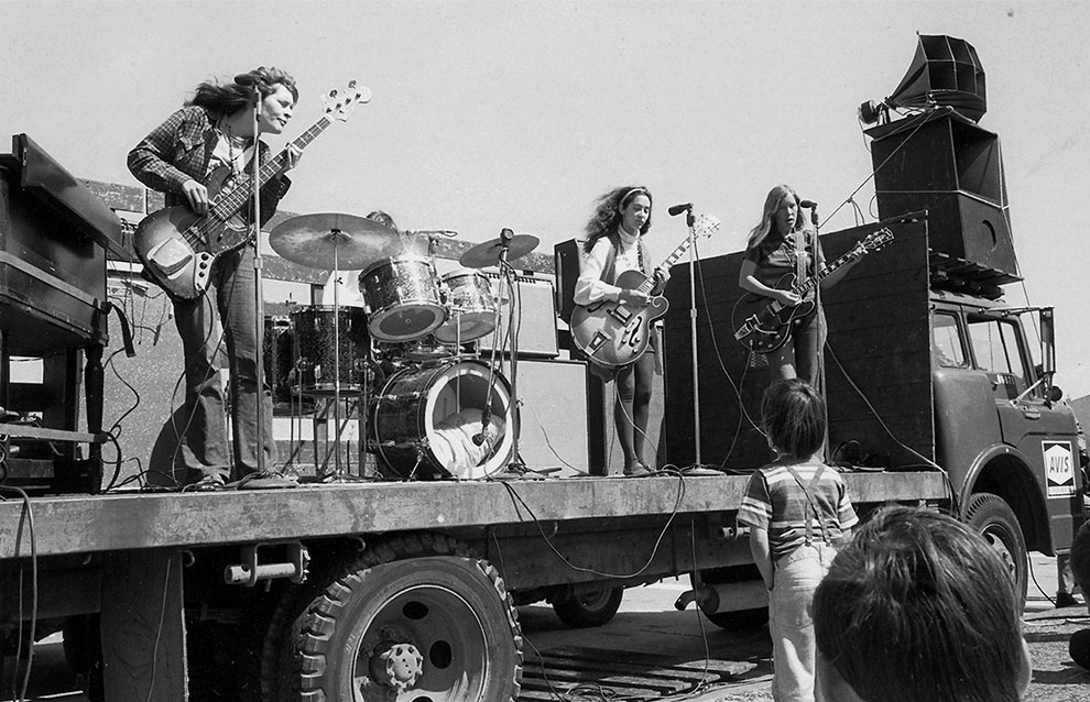 a group of people playing instruments on a truck