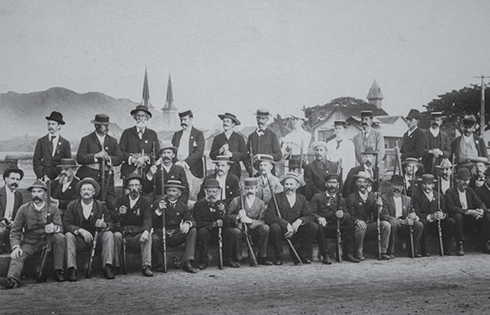 a group of men posing for a photo