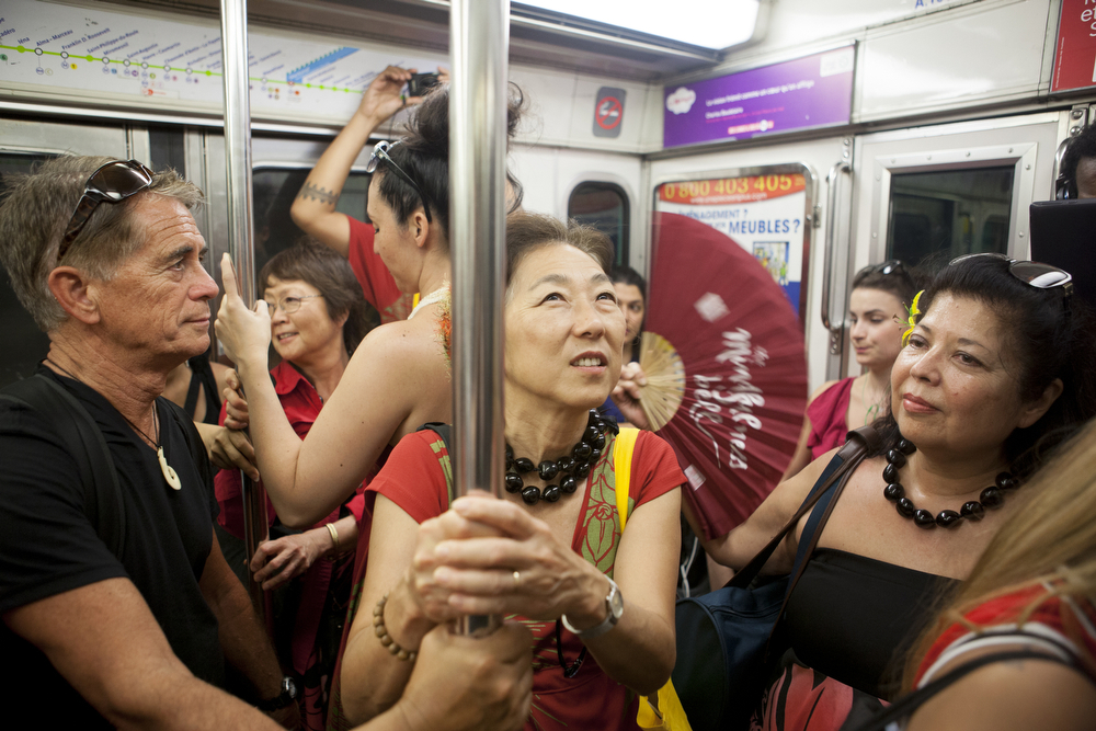 Participants in the Festival des Arts d'Hawai'i ride the Paris subway